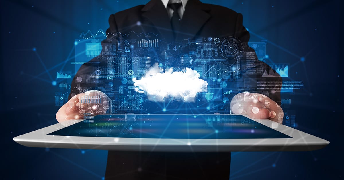 Hand holding tablet with cloud technology concept
