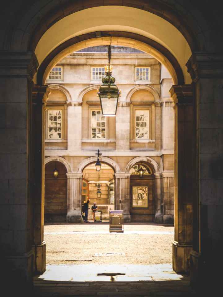gray pendant lamp hanging on arch pathway