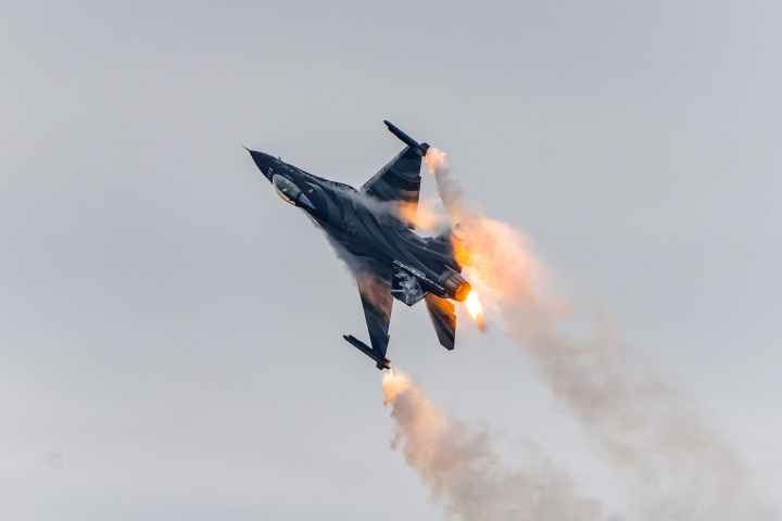 a burning jet plane in mid air