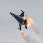 a burning jet plane in mid air