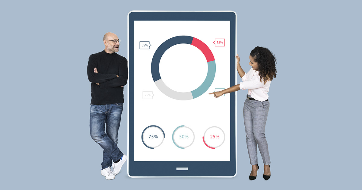Cheerful diverse people showing pie chart on a tablet