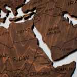wooden puzzle pieces of a world map