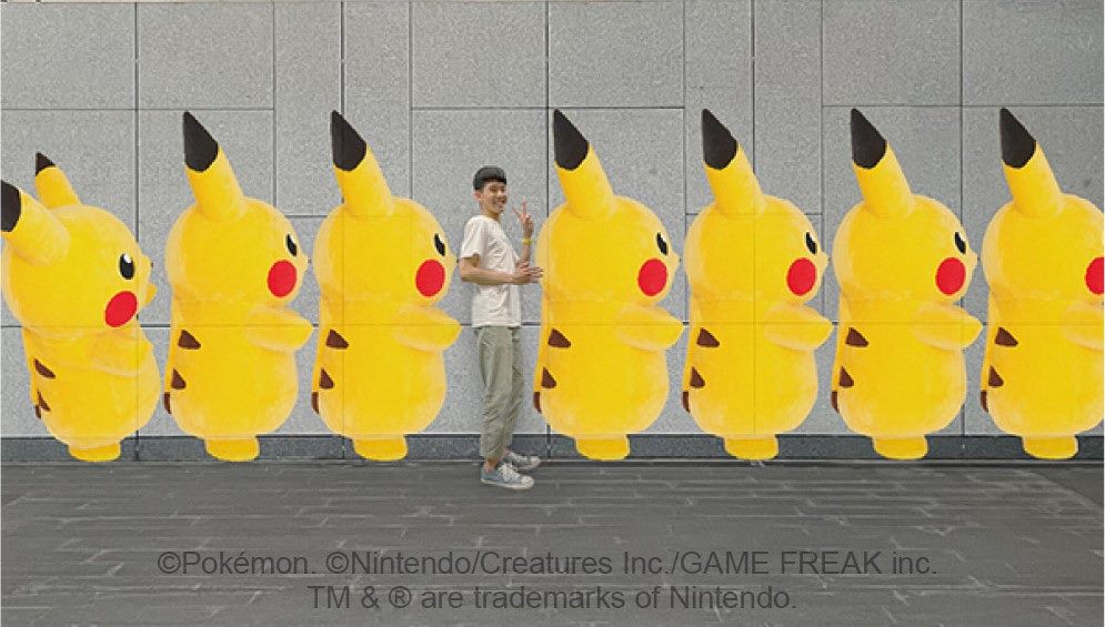 尋找捷運大安森林公園站內的Pokégenic拍照景點,可以鑽進皮卡丘的隊伍裡和牠們一起