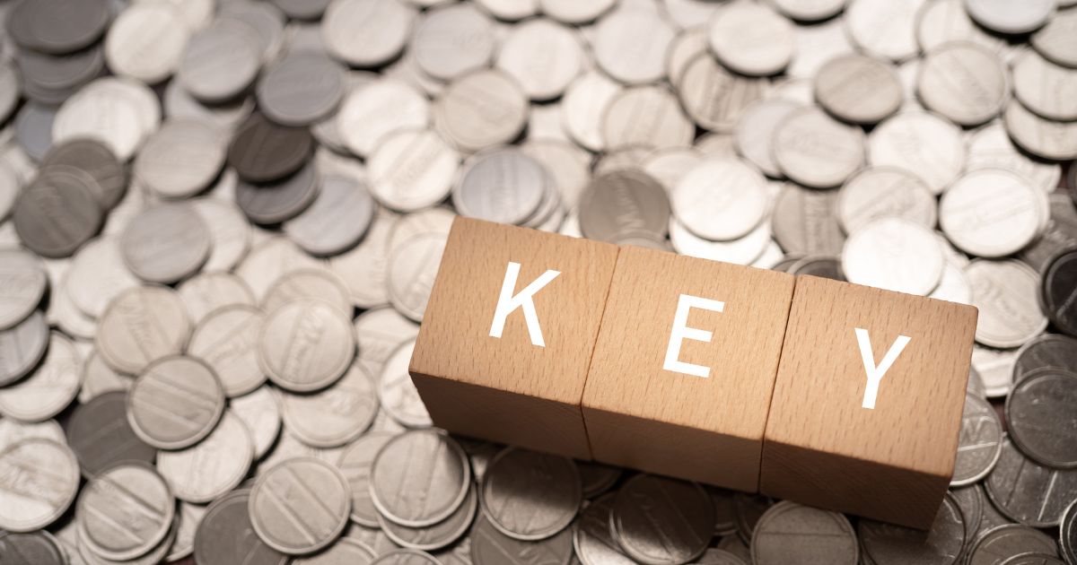 1200-wooden-blocks-with-key-text-concept-coins