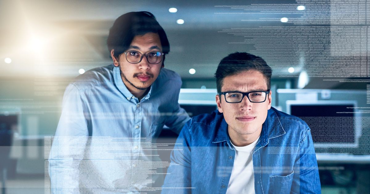 1200-they-are-specialists-this-field-work-portrait-two-young-male-programmers-working-computer-together-office-night