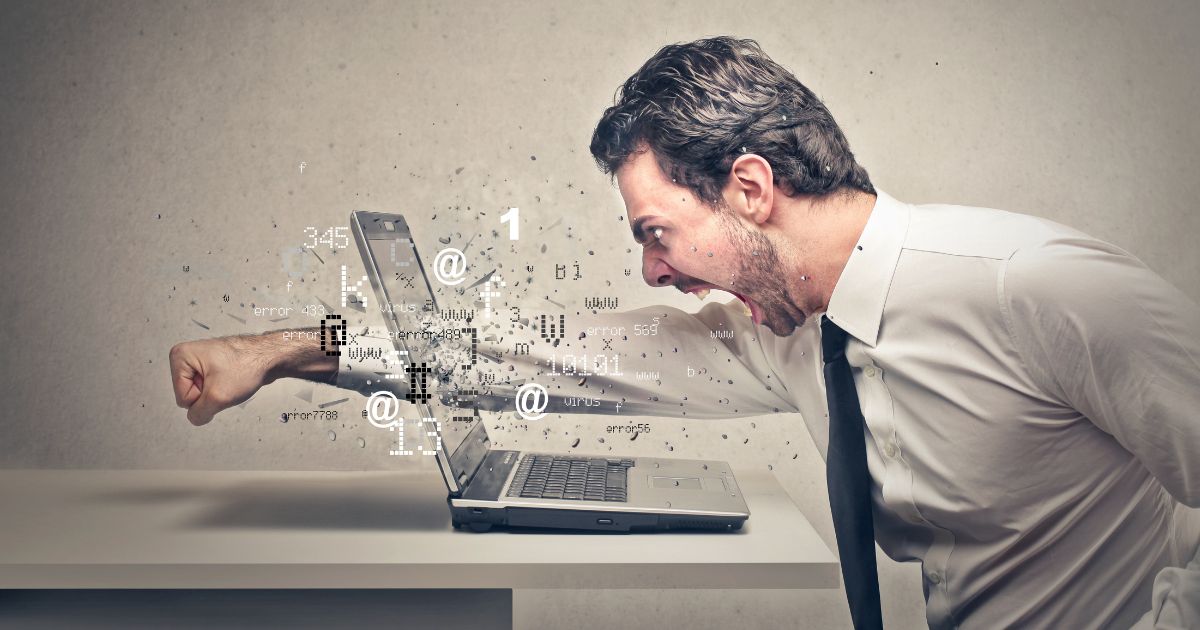 1200-angry-businessman-crushing-his-laptop