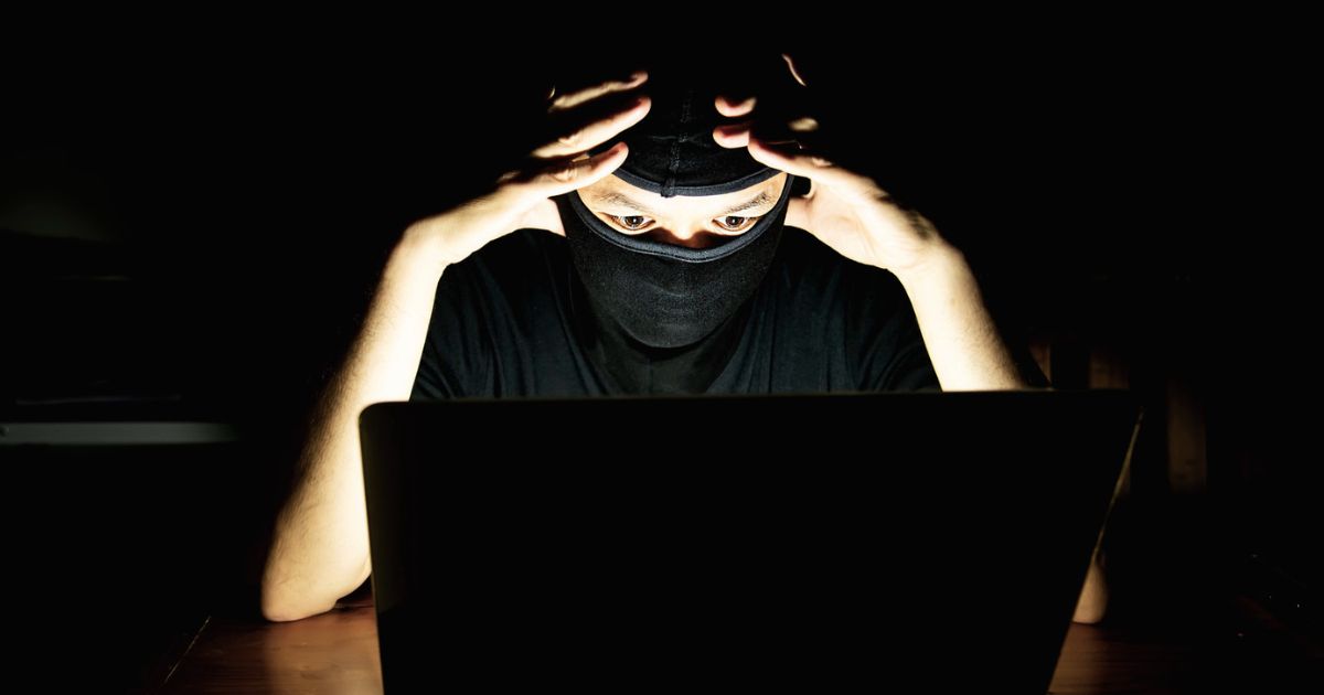 1200 Computer Hacker Doing His Job With Laptop Computer Dark Room