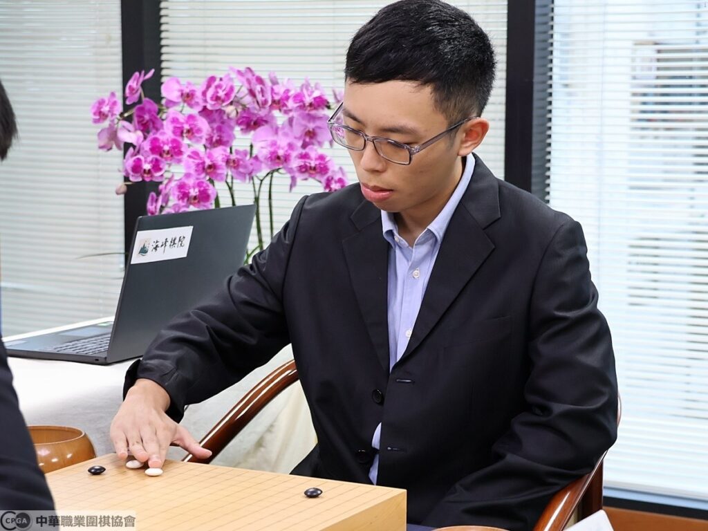 賴均輔九段