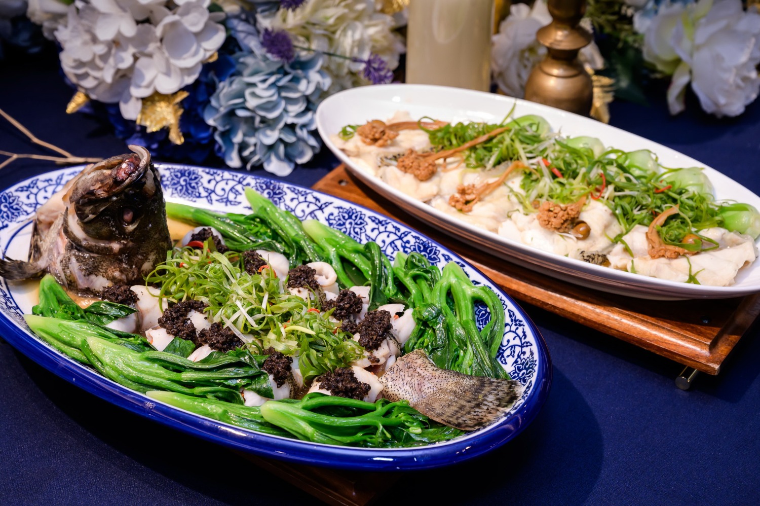 推出的兩道新菜「黑松露麒麟龍虎斑捲」和「澎湖花菜干龍膽石斑」。(圖/農業部漁業署提供)
