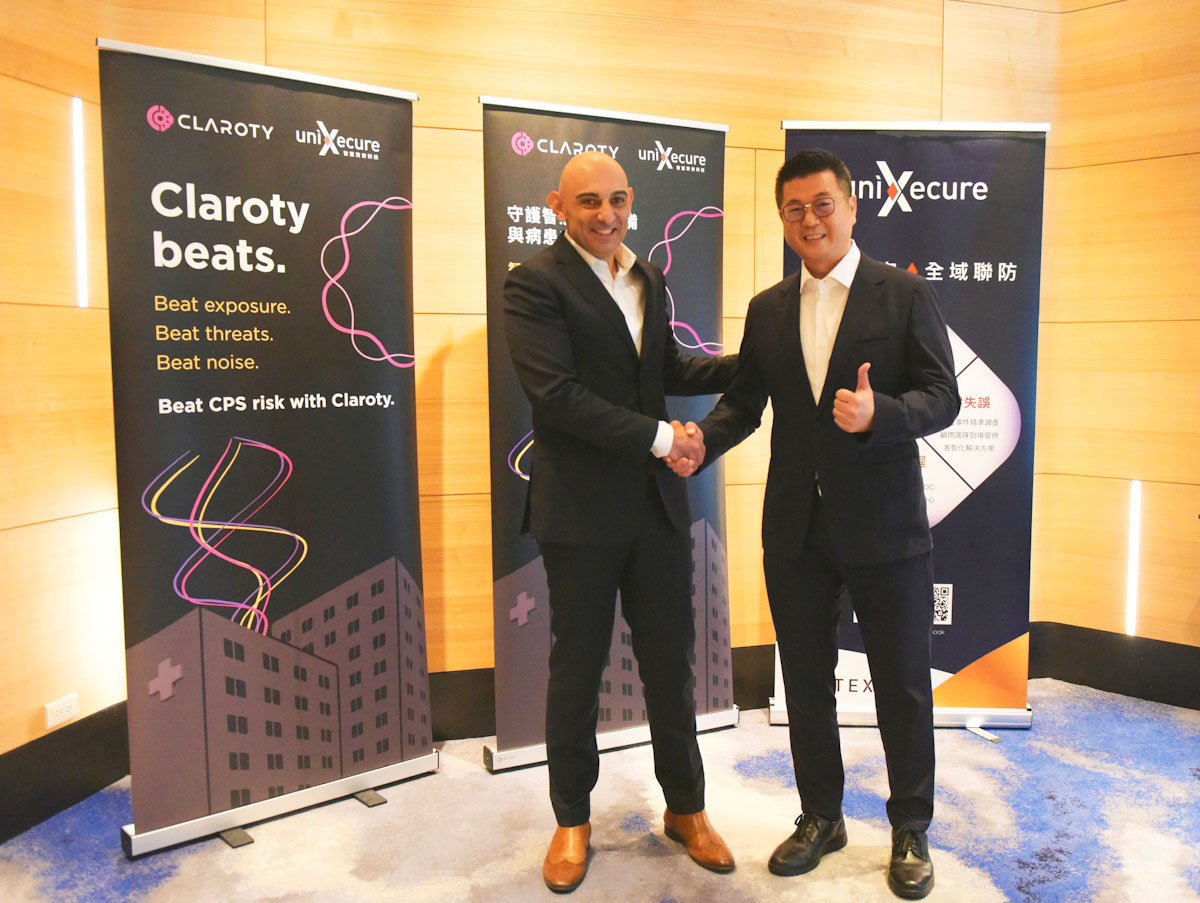 智慧資安科技宣布正式代理全球領先的OT資安品牌Claroty,將攜手提供最具技術領導競爭力的網路實體系統CPS資安防護解決方案。Claroty亞太區總經理Eddie Stefanescu (左)、智慧資安科技董事長詹伊正(右)。