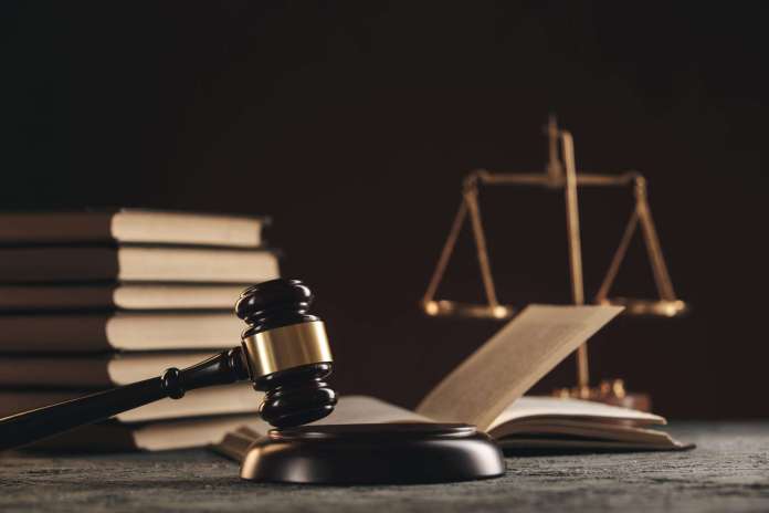 平埔族身分法草案未納入原基法體系 原民會回應了 79 law concept open law book with wooden judges gavel table courtroom law enforcement office black background scaled