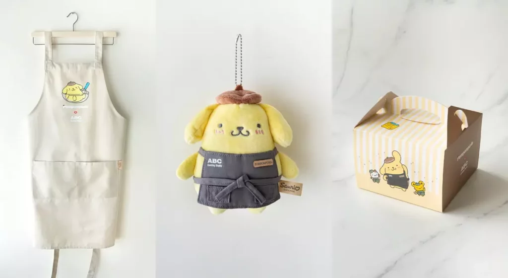 ABC Cooking Studio X 布丁狗聯名周邊包含圍裙、長絨毛吊飾與甜點提盒