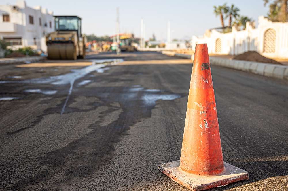 close up orange traffic cone road copy space
