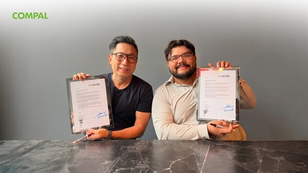 Alan Chang, Vice President of Infrastructure Solutions Business Group at Compal, and Jorge Santos, Chief Operating Officer at Verda, hold framed partnership agreements during a signing ceremony Alan Chang, Vice President of Infrastructure Solutions Business Group at Compal, and Jorge Santos, Chief Operating Officer at Verda, hold framed partnership agreements during a signing ceremony