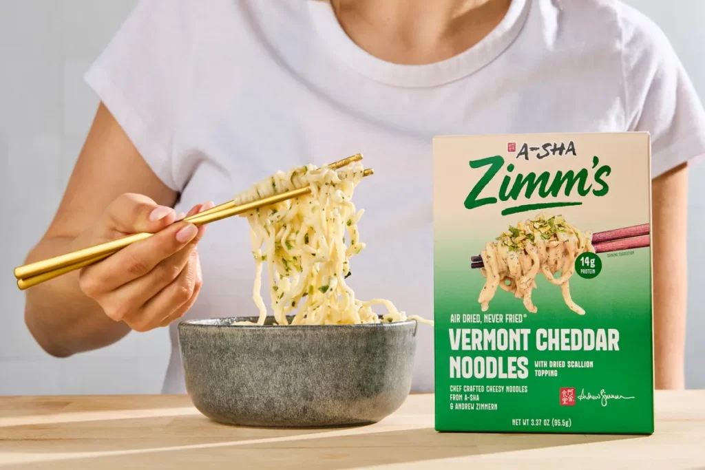 阿舍獨家與美國傳奇大廚兼節目主持人Andrew Zimmern展開合作,共創「Zimm's」國際品牌,並由主廚開發多款以亞洲風味結合美式口感的食品產品,於全美Target通路獨家上市。